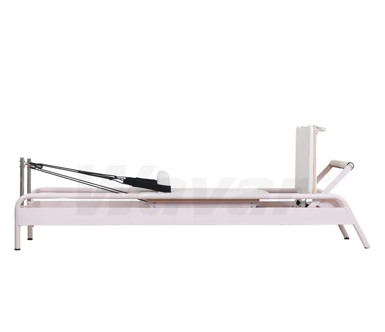 Nuovo riformatore di pilates in acciaio rosa con barra incorporata