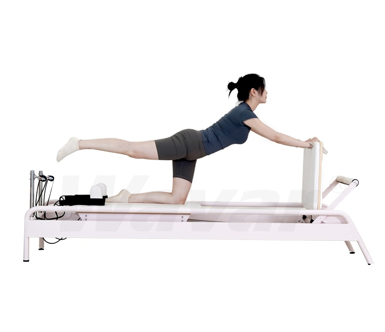 Nuovo riformatore di pilates in acciaio rosa con barra incorporata