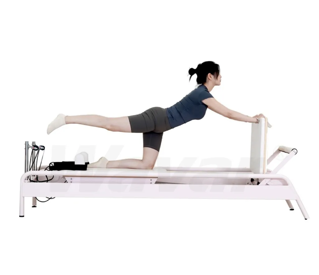 Nuovo riformatore di pilates in acciaio rosa con barra incorporata