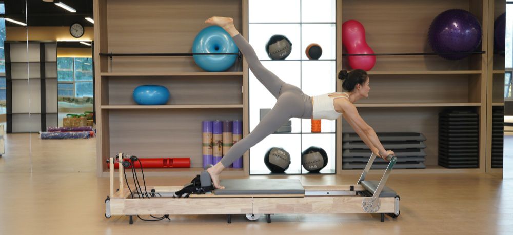 Il bilanciamento del corpo in legno pieghevole Pilates riformatore del letto centrale Il bilanciamento del corpo in legno pieghevole Pilates riformatore del letto centrale